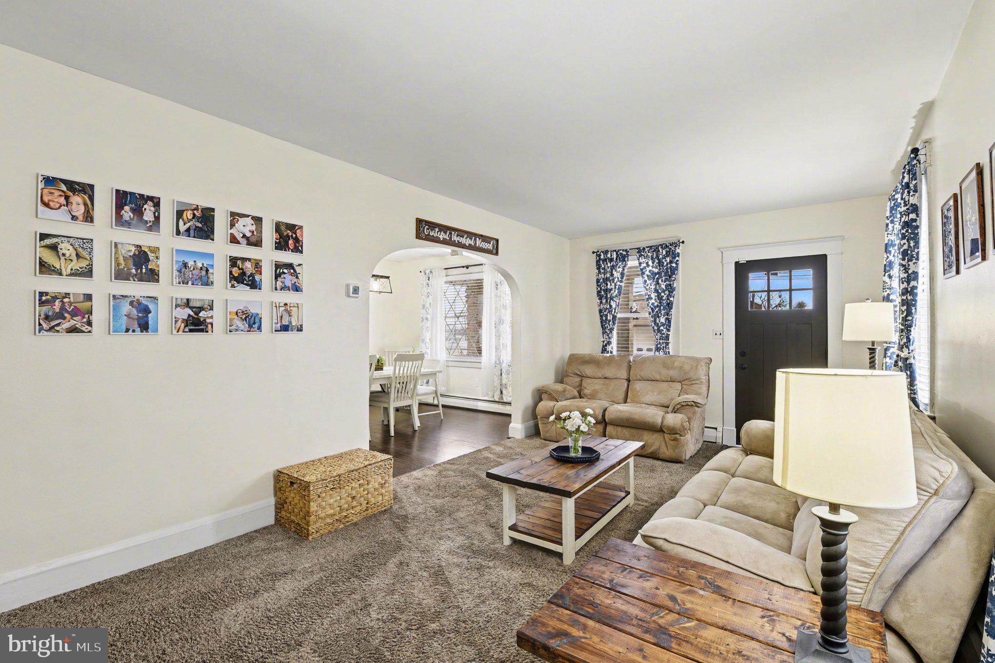 6807 North Point Road Sparrows Point, MD 21219 - Photo 4 of 28 a living room with furniture and wooden floor