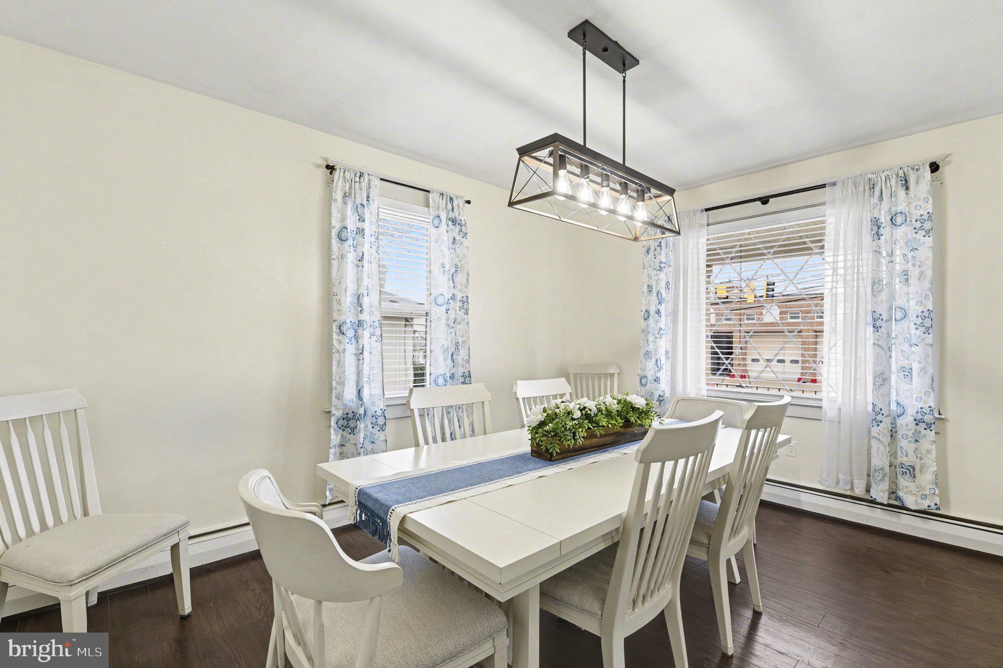 6807 North Point Road Sparrows Point, MD 21219 - Photo 5 of 28 a view of a dining room with furniture window and wooden floor
