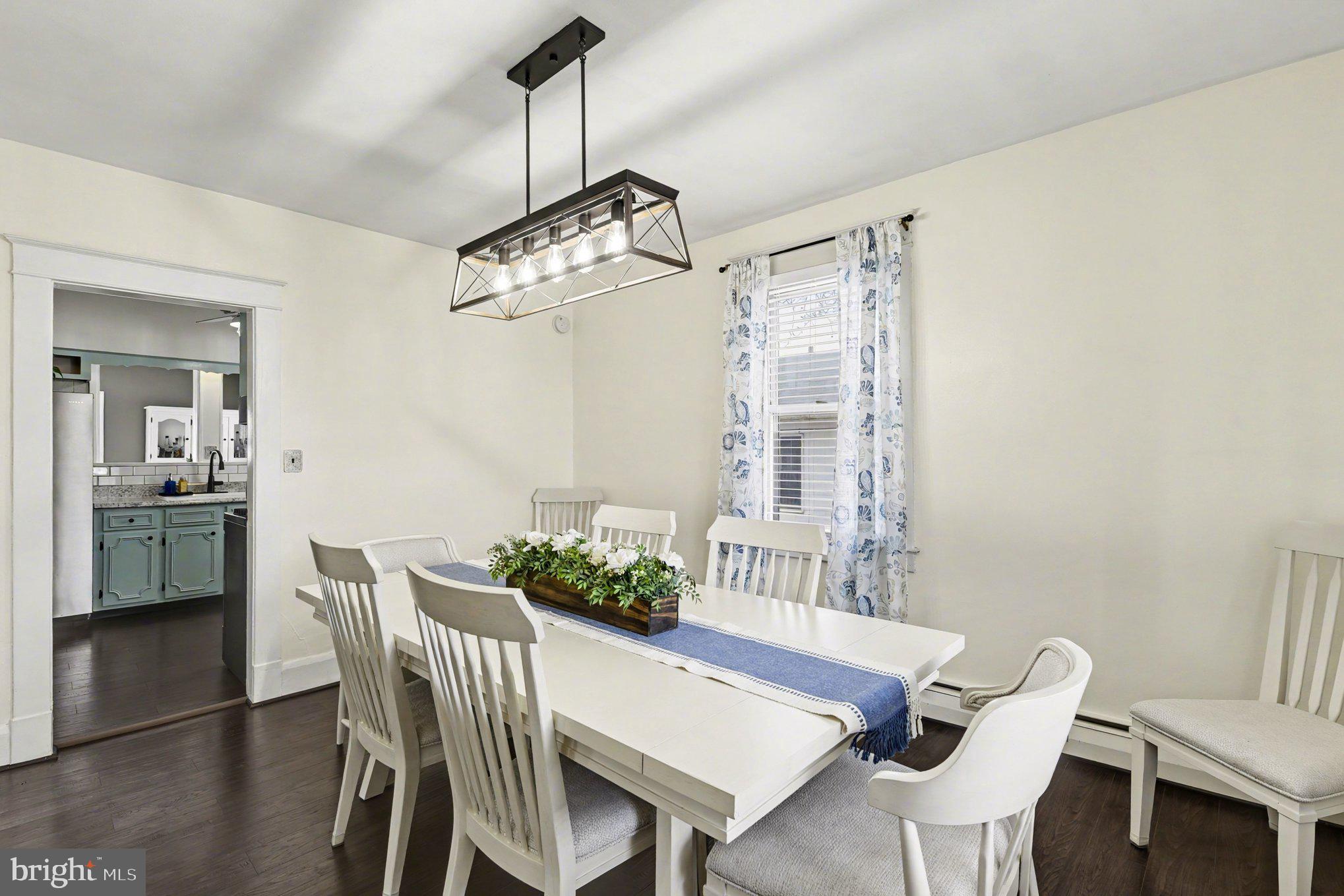 6807 North Point Road Sparrows Point, MD 21219 - Photo 6 of 28 a view of a dining room with furniture window and wooden floor