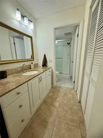 a bathroom with a double vanity sink and mirror