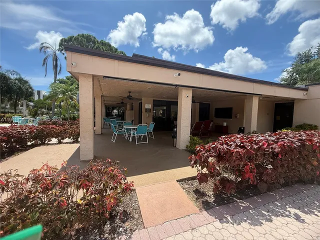a view of outdoor space with swimming pool and seating