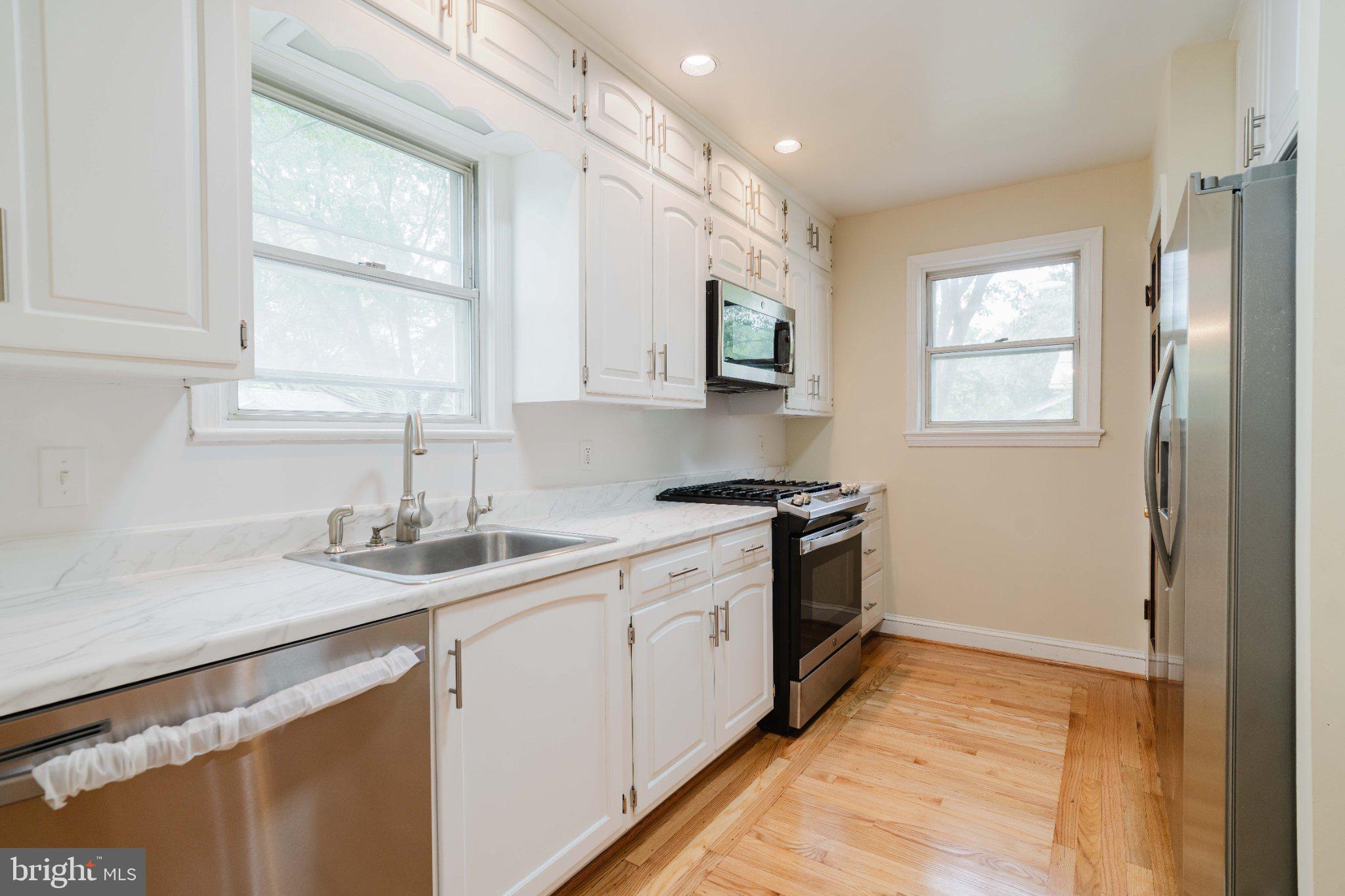10200 Duvawn Place Silver Spring, MD 20902 - Photo 6 of 42 Bright and airy modern kitchen space.