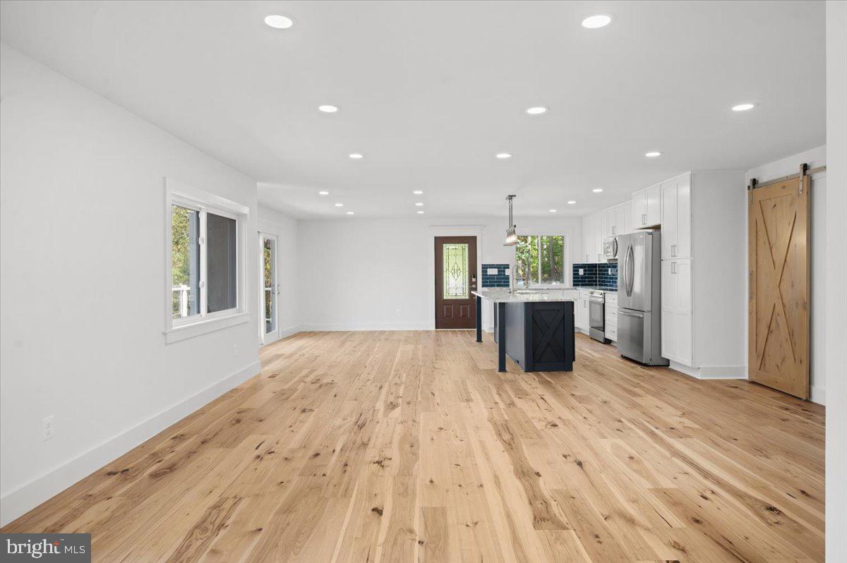 4117 Crow Rock Road Myersville, MD 21773 - Photo 17 of 97 a kitchen with stainless steel appliances kitchen island granite countertop a refrigerator and a sink