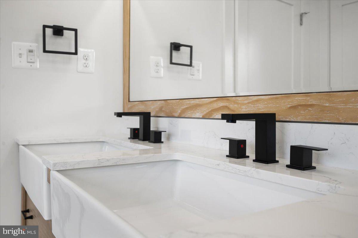 4117 Crow Rock Road Myersville, MD 21773 - Photo 35 of 97 a bathroom with a sink and a mirror