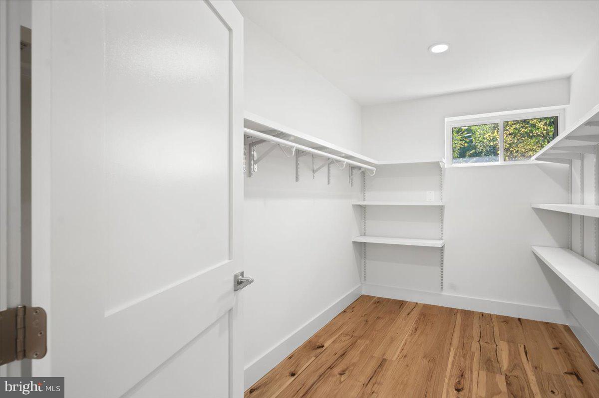 4117 Crow Rock Road Myersville, MD 21773 - Photo 36 of 97 a view of a room with wooden floor and cabinets