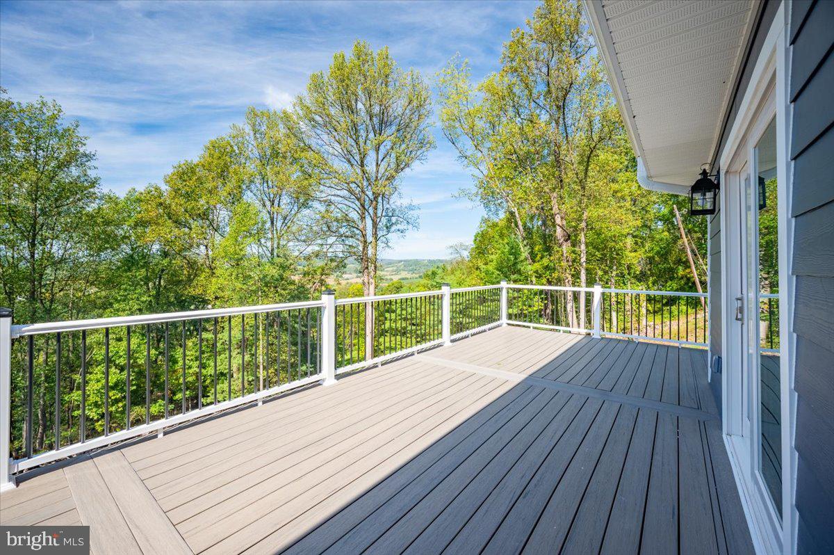 4117 Crow Rock Road Myersville, MD 21773 - Photo 71 of 97 a view of a balcony with wooden floor and fence