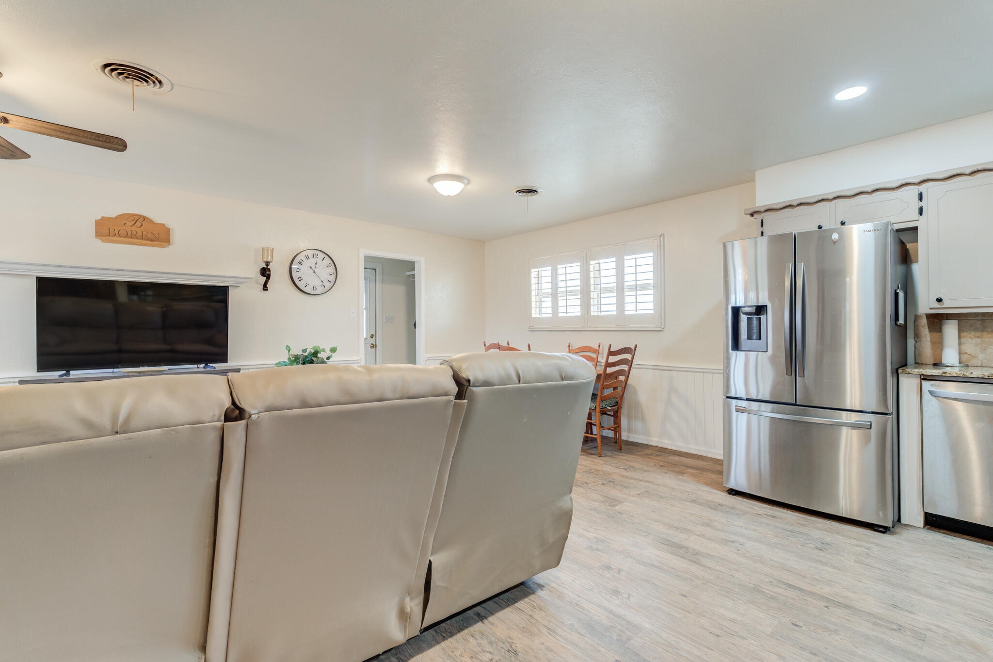 2141 71st Street Lubbock, TX 79412 - Photo 15 of 36 a living room with furniture and a flat screen tv