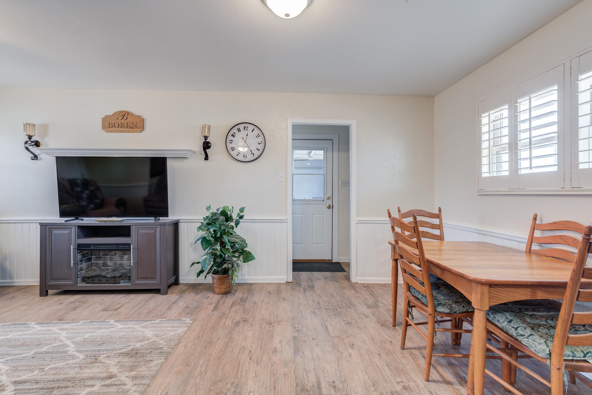 2141 71st Street Lubbock, TX 79412 - Photo 17 of 36 a view of a livingroom with furniture and a flat screen tv