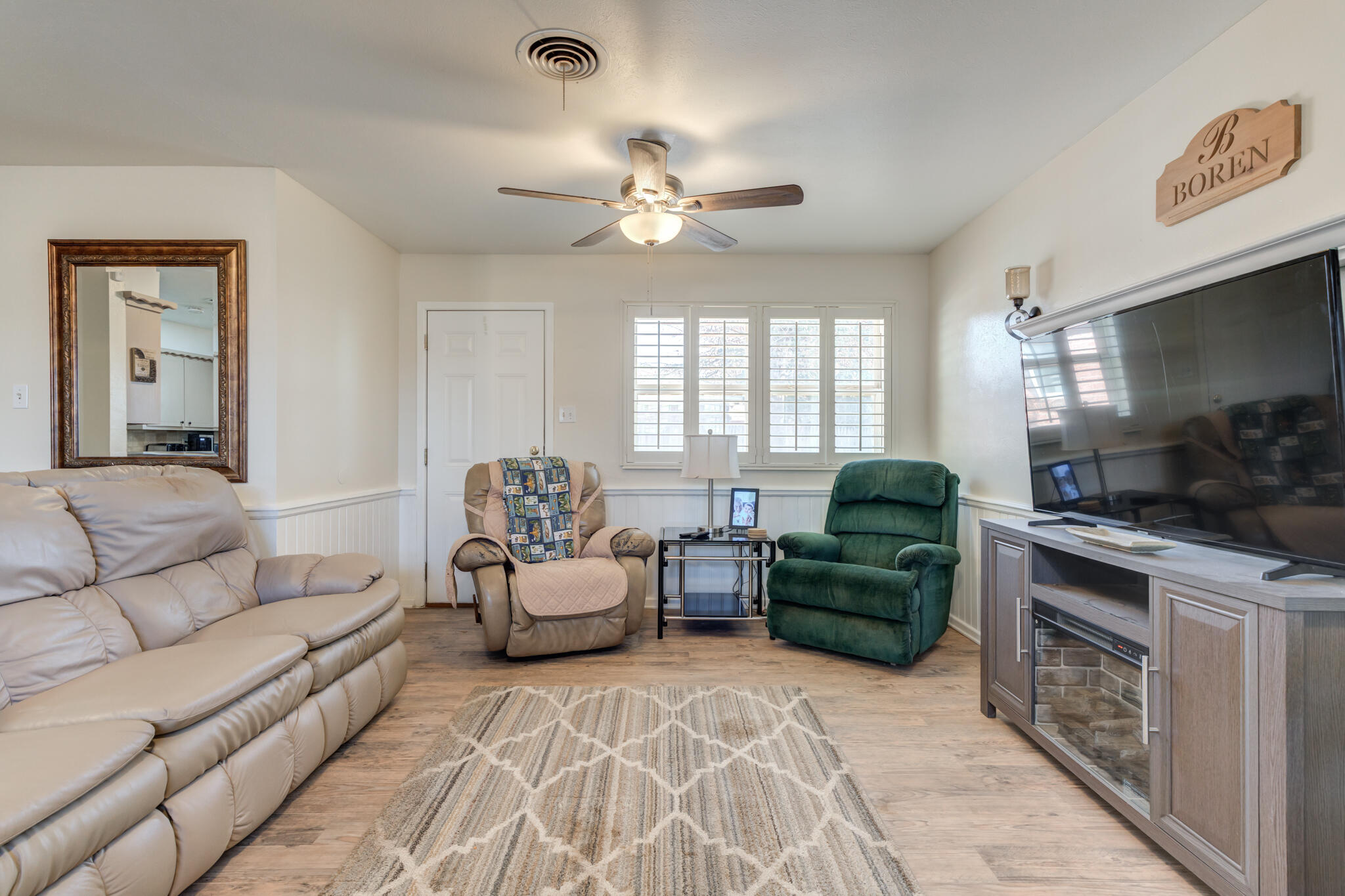 2141 71st Street Lubbock, TX 79412 - Photo 19 of 36 a living room with furniture and a fireplace