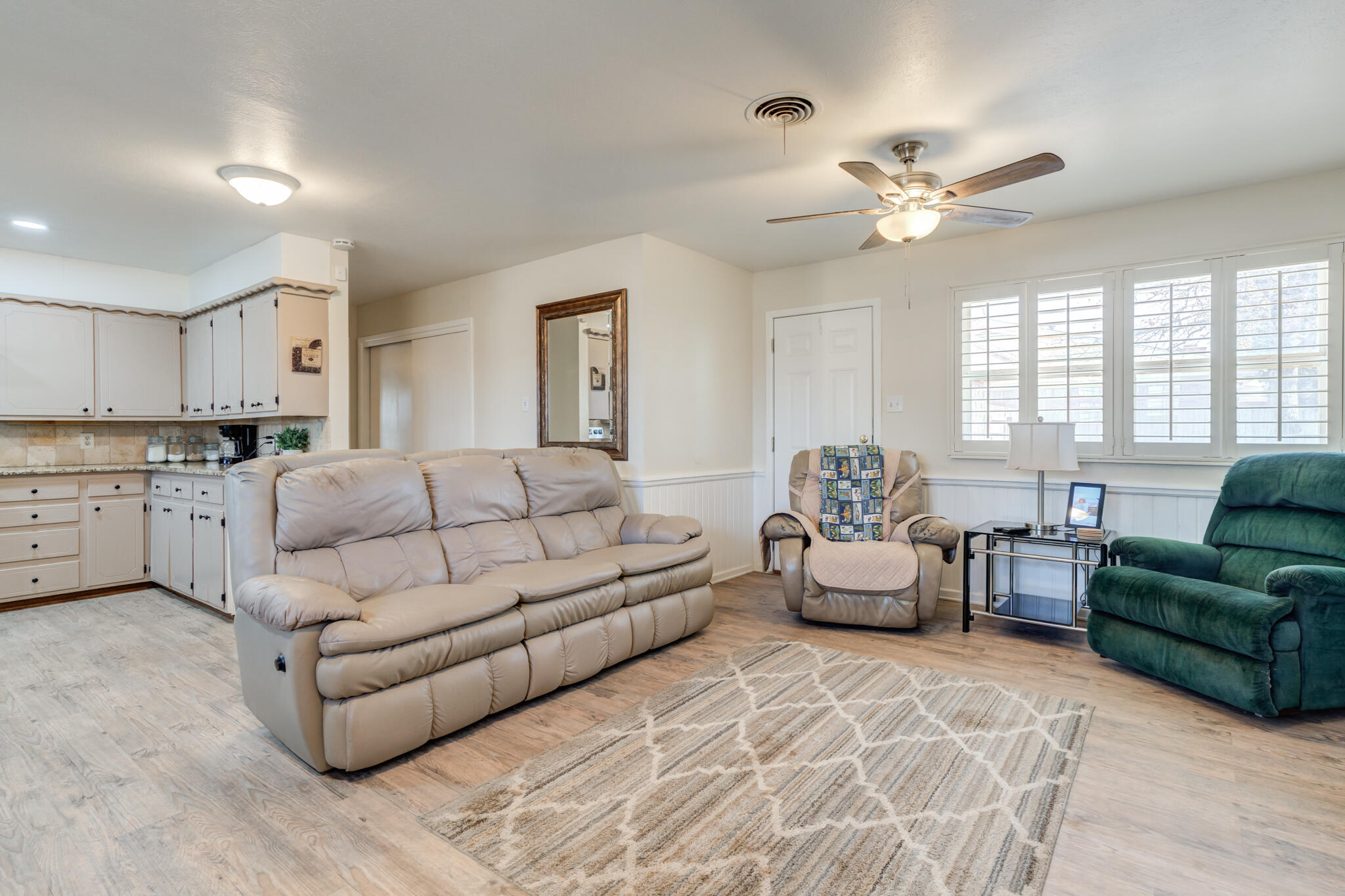 2141 71st Street Lubbock, TX 79412 - Photo 20 of 36 a living room with furniture and a large window