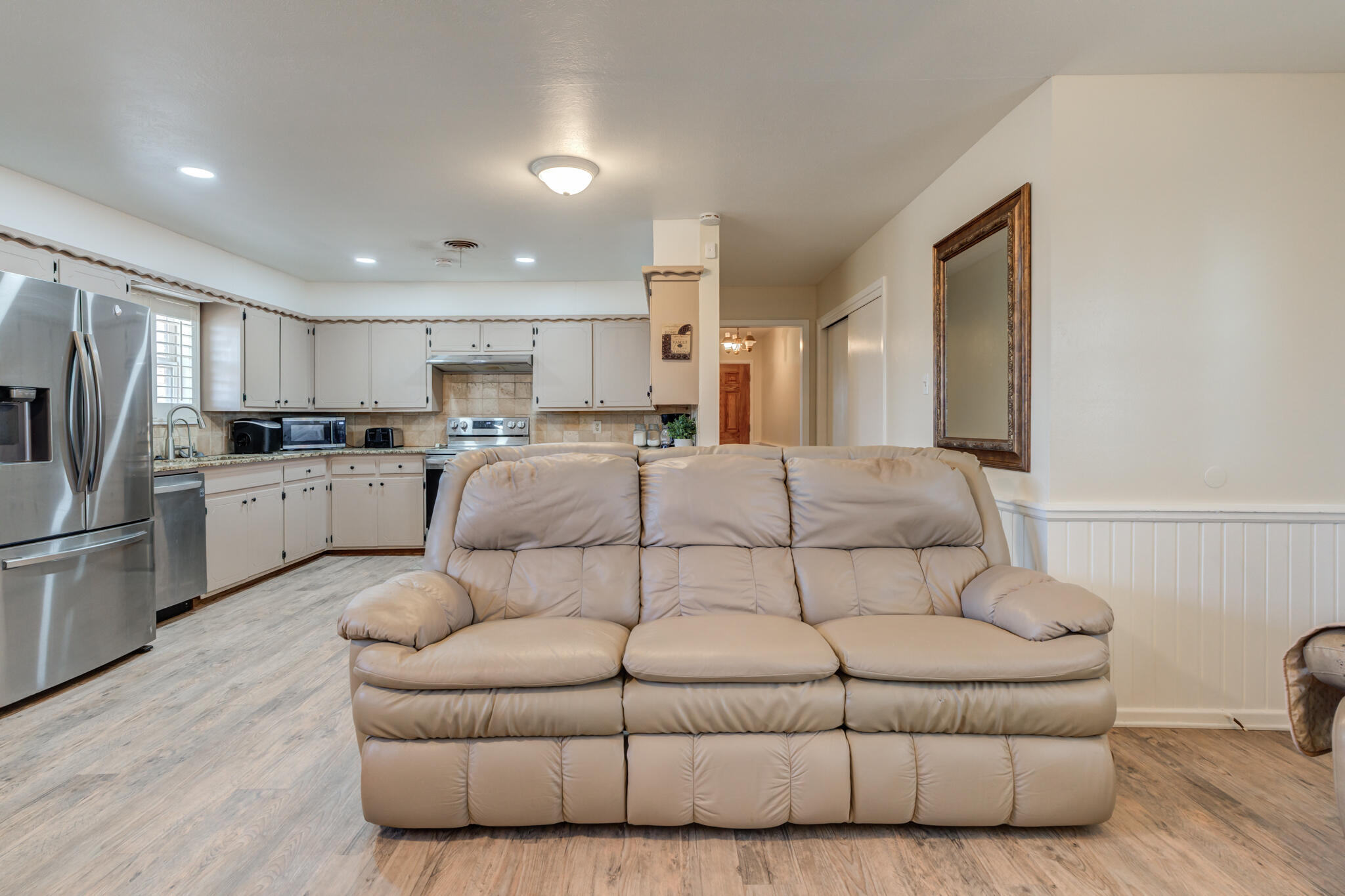 2141 71st Street Lubbock, TX 79412 - Photo 21 of 36 a living room with furniture and kitchen view