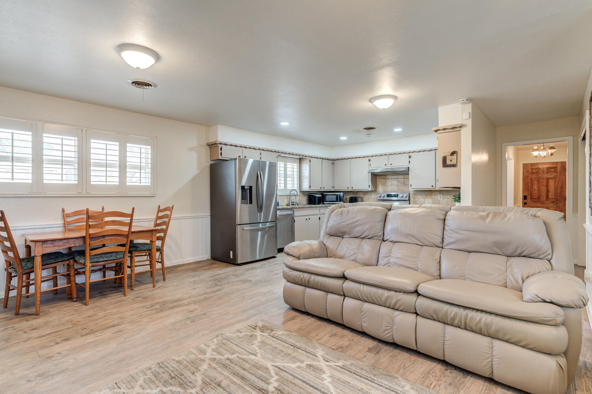 2141 71st Street Lubbock, TX 79412 - Photo 22 of 36 a living room with furniture and kitchen view
