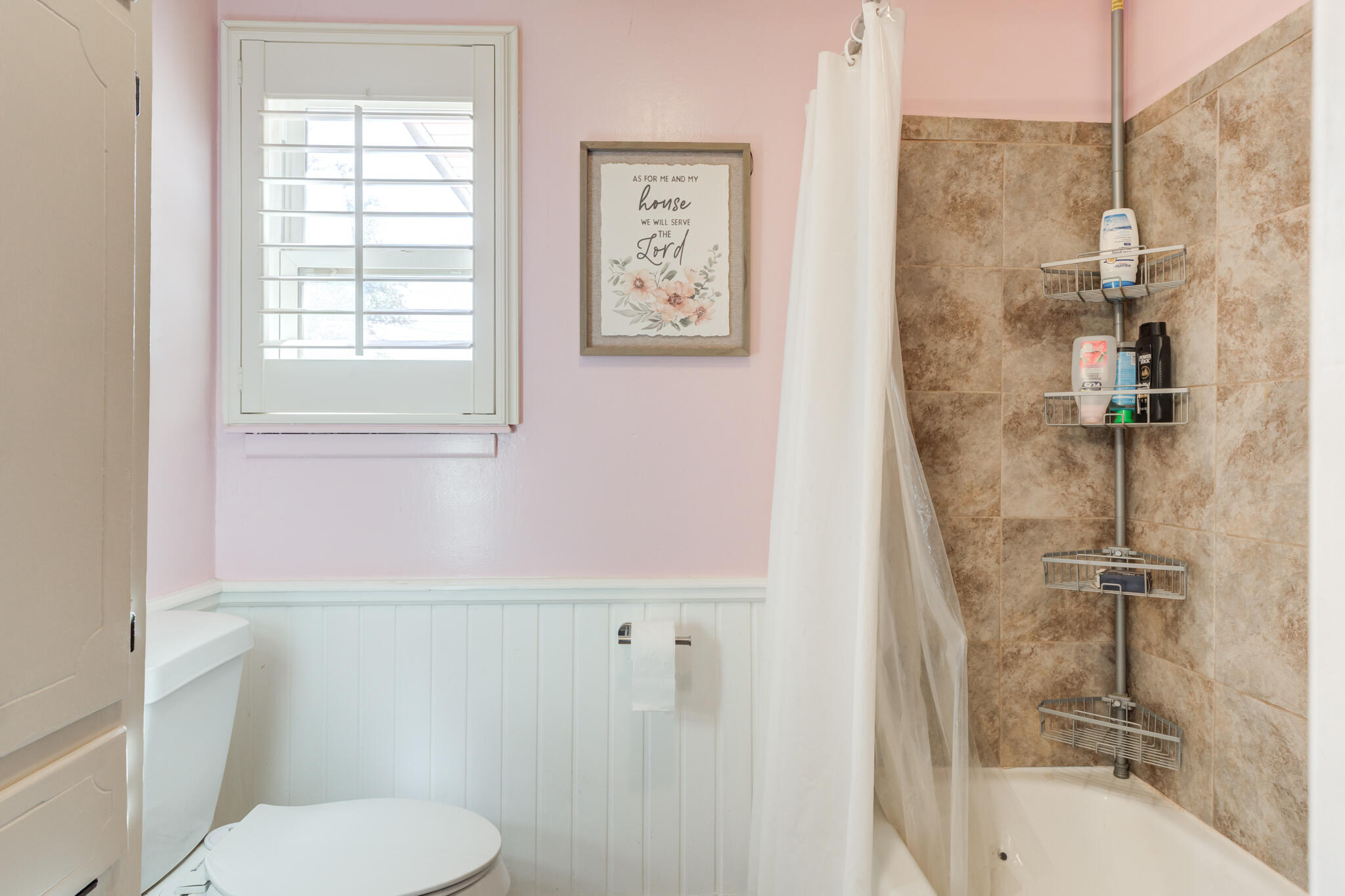 2141 71st Street Lubbock, TX 79412 - Photo 27 of 36 a bathroom with a toilet and a shower