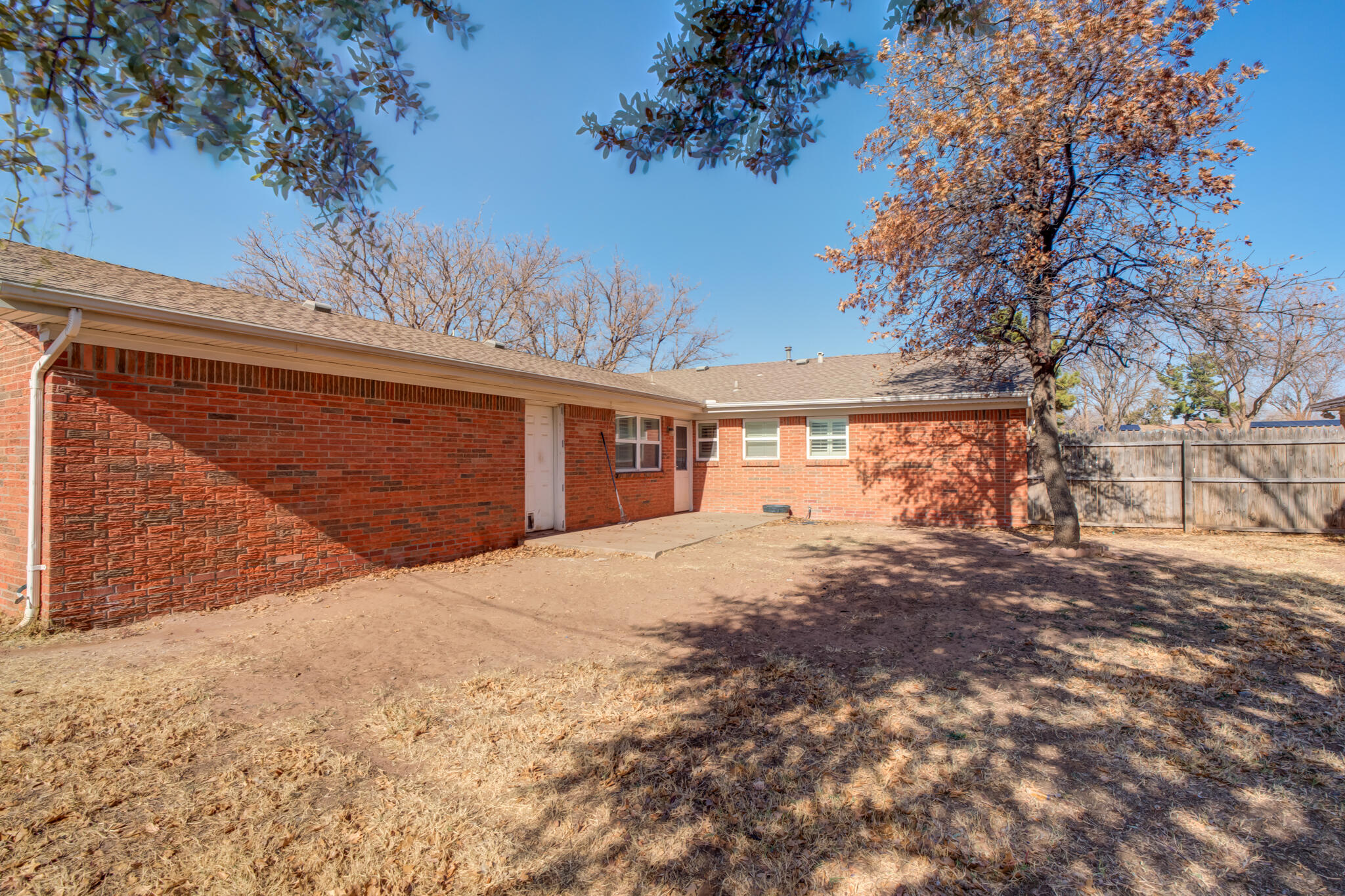 2141 71st Street Lubbock, TX 79412 - Photo 36 of 36 a front view of a house with a yard and garage