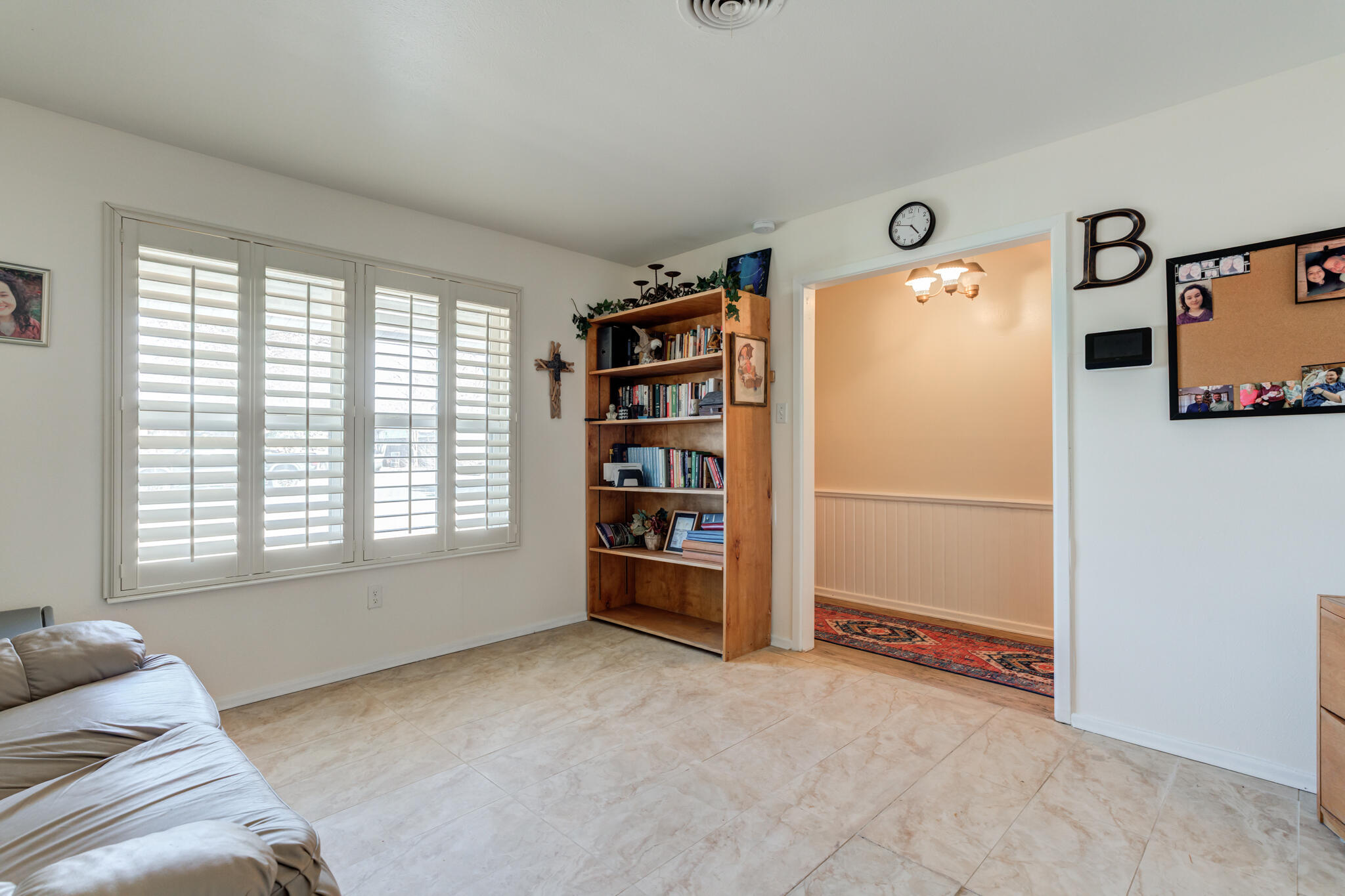 2141 71st Street Lubbock, TX 79412 - Photo 8 of 36 a view of an empty room with a window and cabinet
