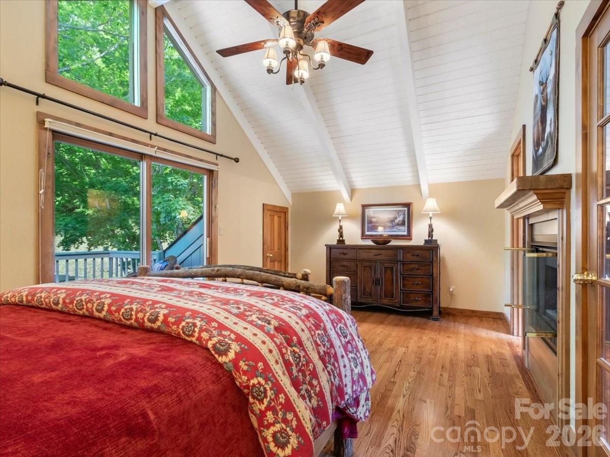 121 Ivy Ridge Road Burnsville, NC 28714 - Photo 31 of 48 a bed sitting in a bedroom next to a window