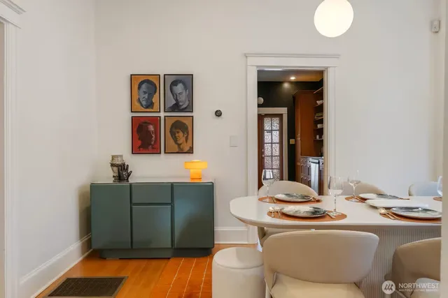 a living room with furniture and a mirror