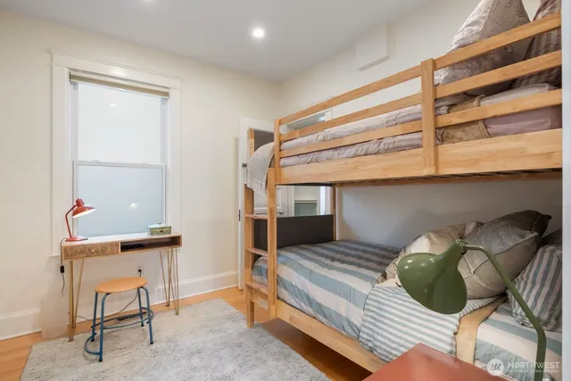 a bedroom with a bed and a chair