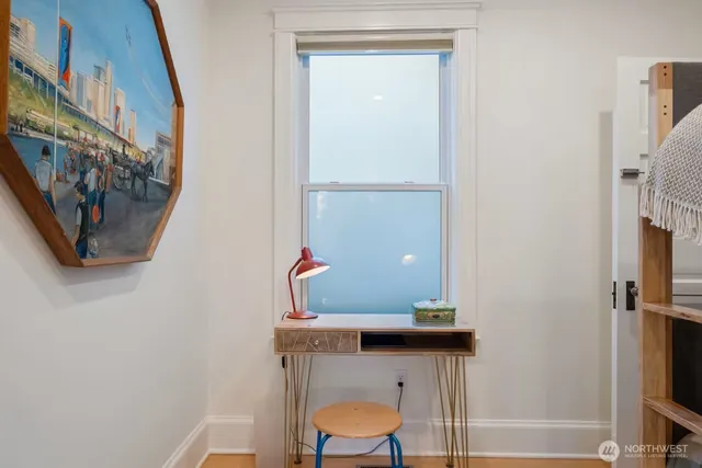 a room with a table and a mirror