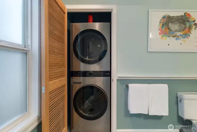 a view of a hallway with washer and dryer