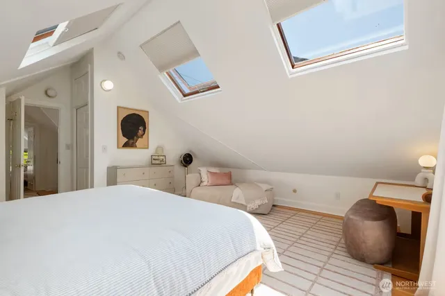 a bedroom with a bed and a view of bathroom