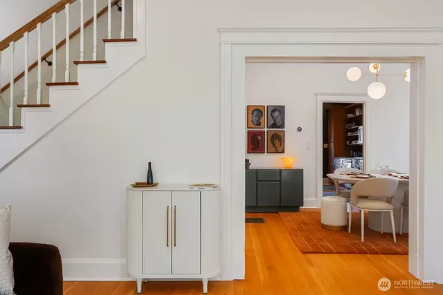 a view of entryway and hall with wooden floor