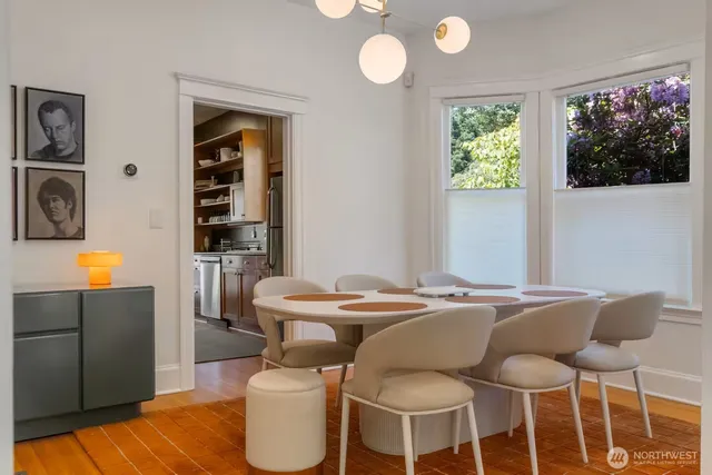 a dining room with furniture and window