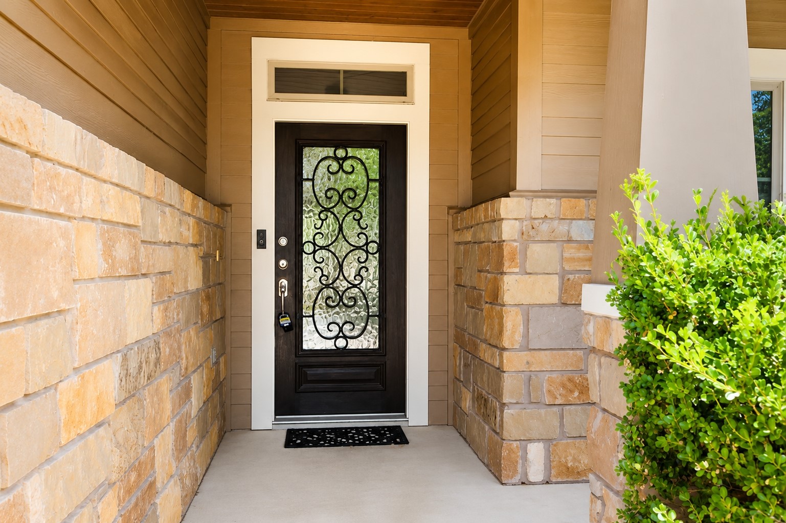 304 Santa Maria Street Georgetown, TX 78628 - Photo 2 of 37 A welcoming front entrance featuring a richly detailed door with an ornate iron insert. Virtually Enhanced.