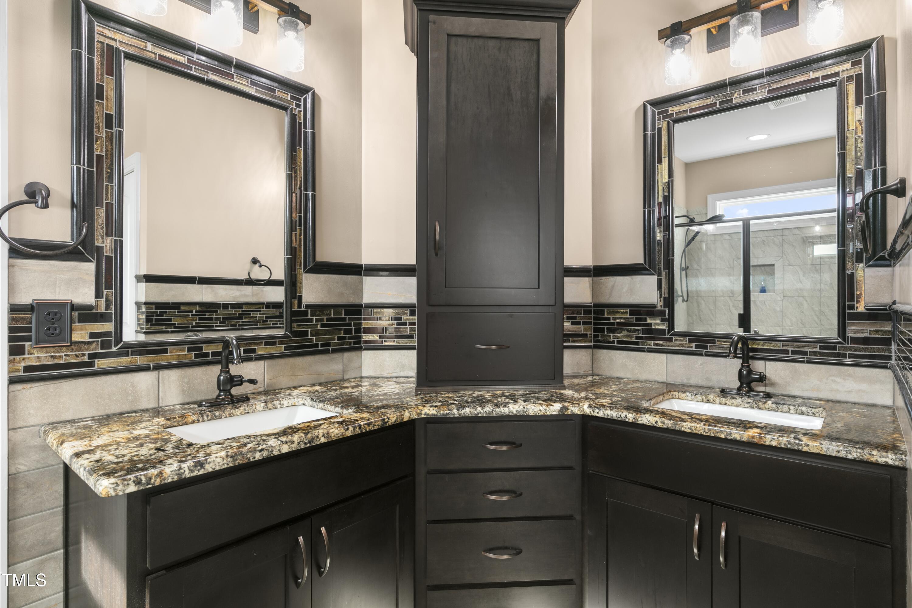 1044 Butterfly Circle Wake Forest, NC 27587 - Photo 18 of 46 a bathroom with a granite countertop sink vanity and mirror