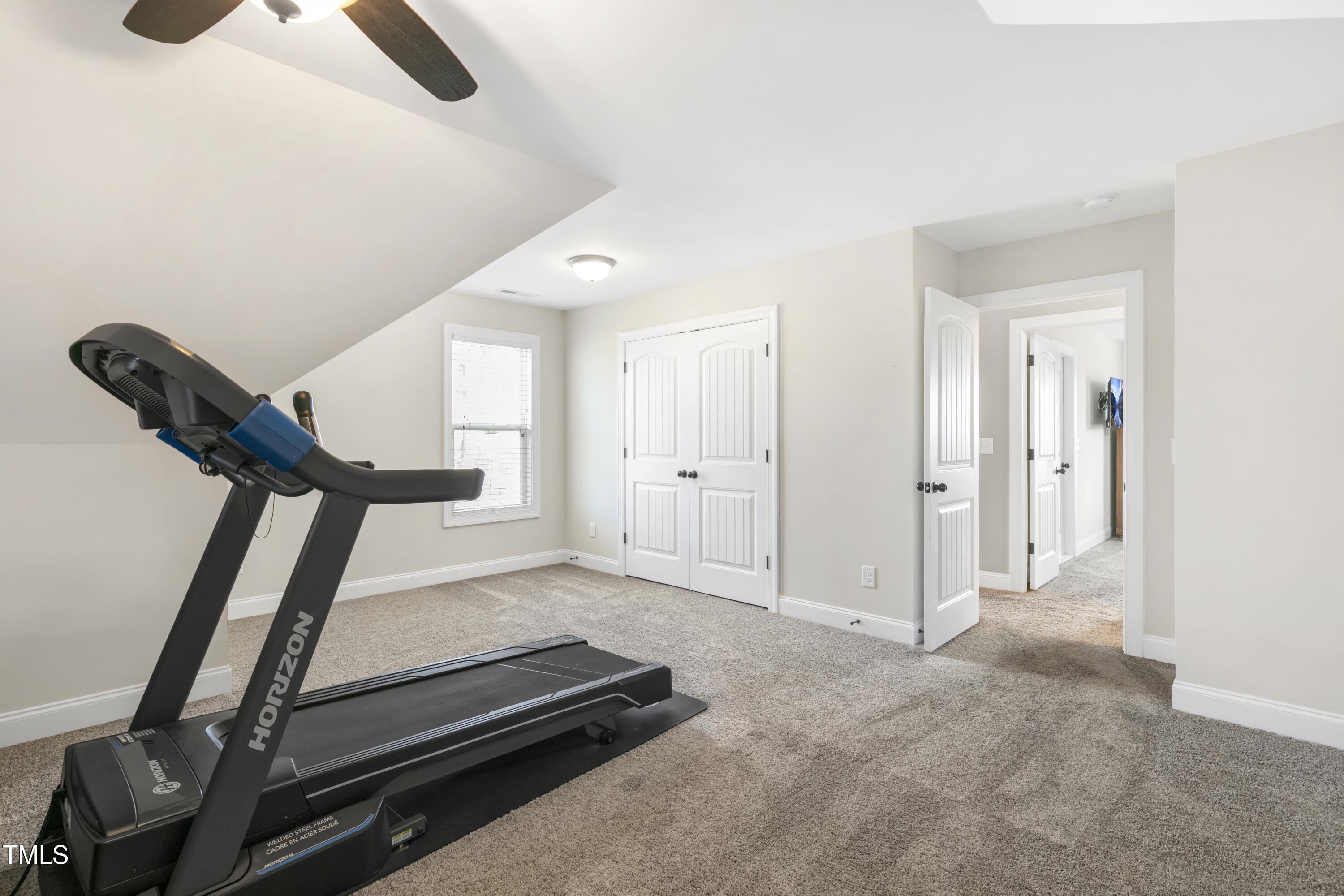 1044 Butterfly Circle Wake Forest, NC 27587 - Photo 29 of 46 a view of a room with gym equipment