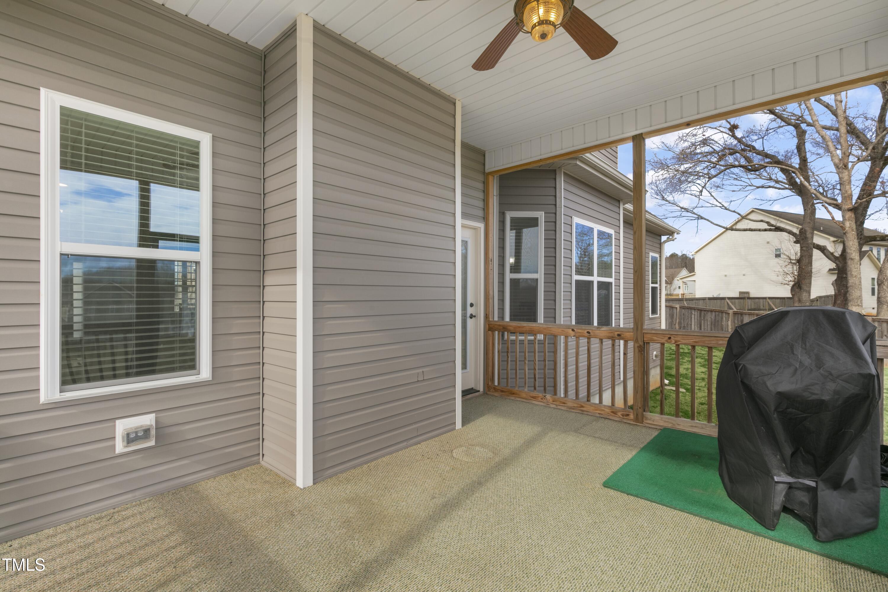 1044 Butterfly Circle Wake Forest, NC 27587 - Photo 36 of 46 a view of a porch with furniture and a yard