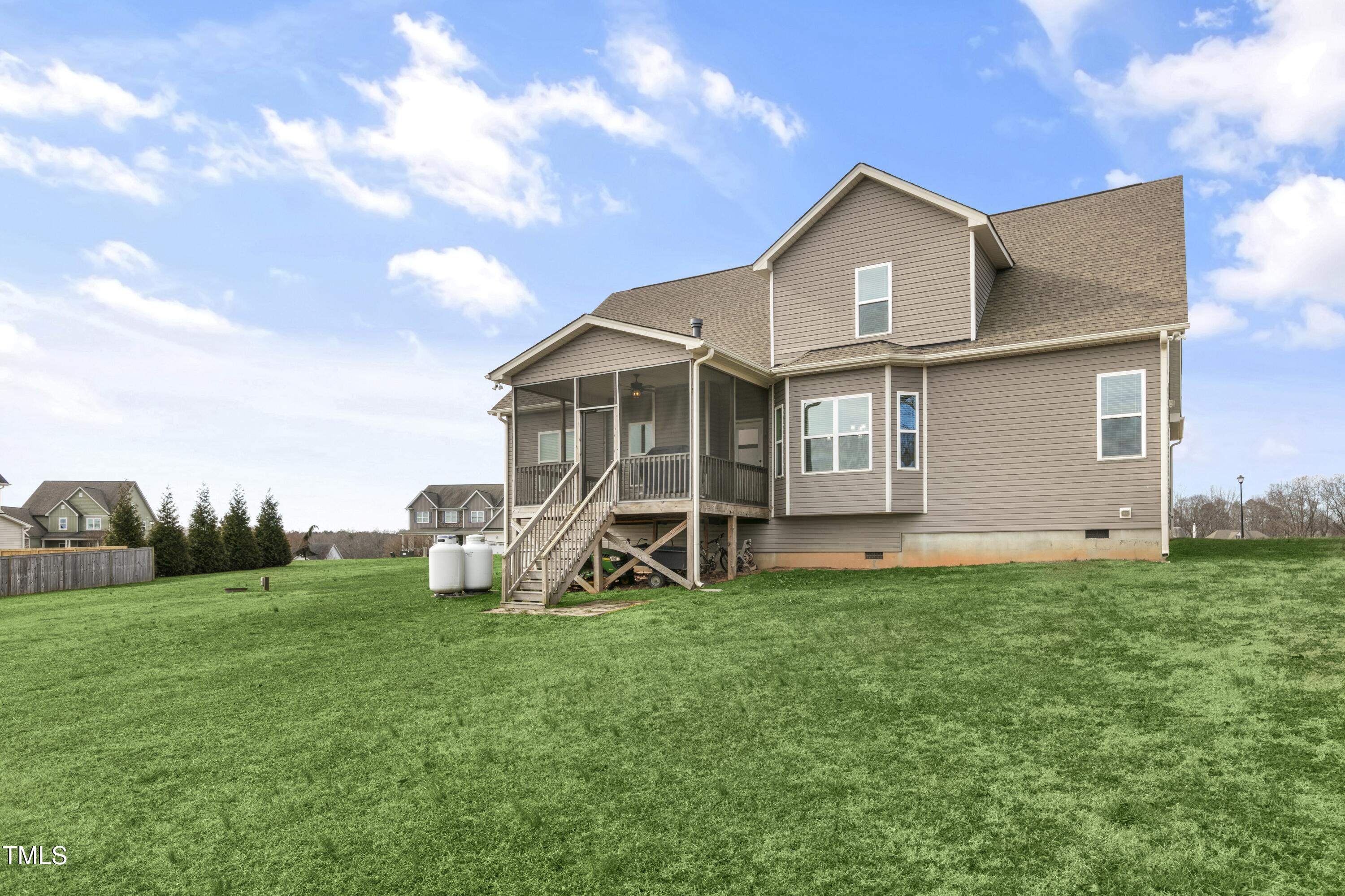 1044 Butterfly Circle Wake Forest, NC 27587 - Photo 37 of 46 a view of a house with a yard and sitting area