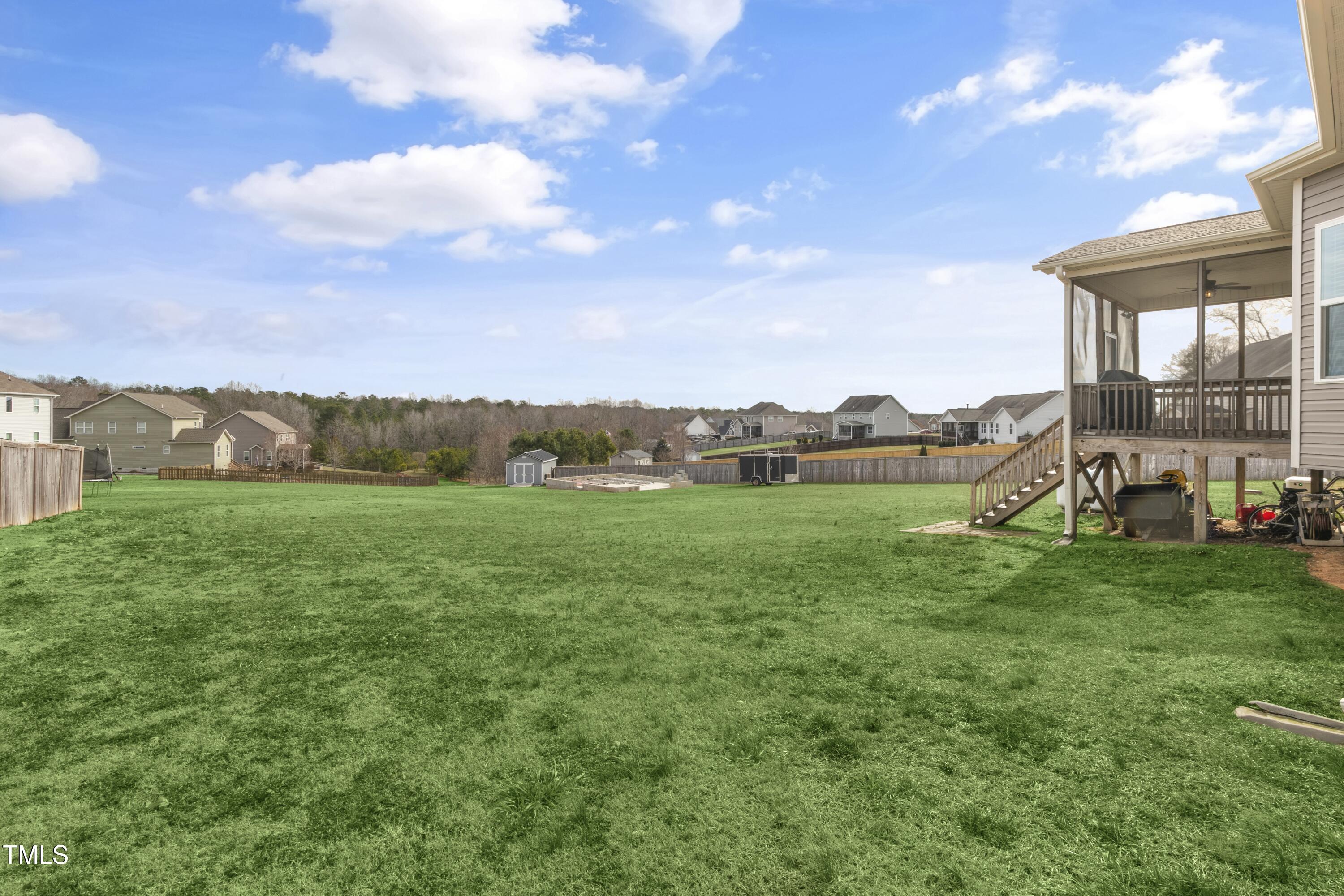 1044 Butterfly Circle Wake Forest, NC 27587 - Photo 40 of 46 a view of a garden with an outdoor seating