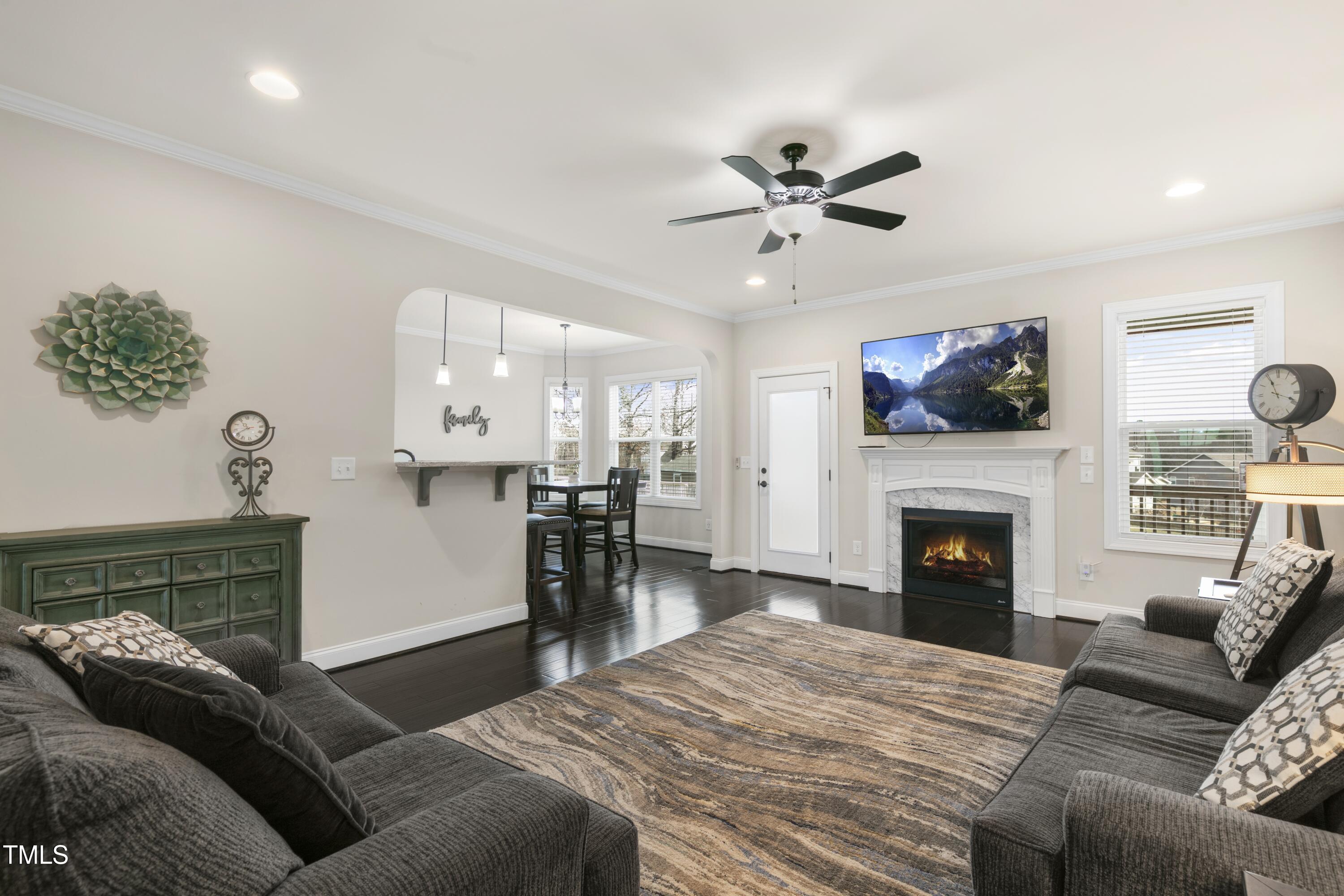 1044 Butterfly Circle Wake Forest, NC 27587 - Photo 8 of 46 a living room with furniture and a fireplace
