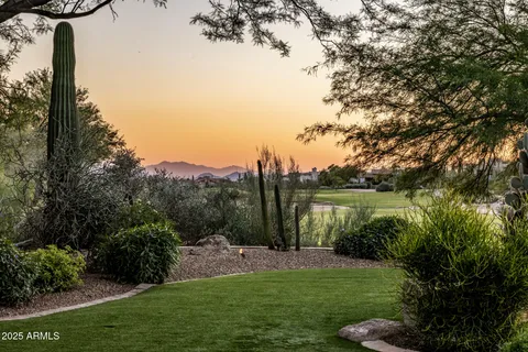 a view of a dining room with furniture wooden floor and chandelier
