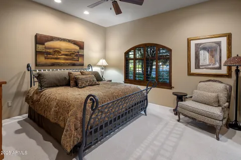 a living room with furniture a window and a chandelier