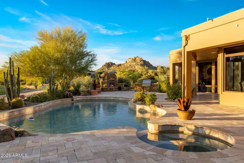 a front view of a house with barbeque area