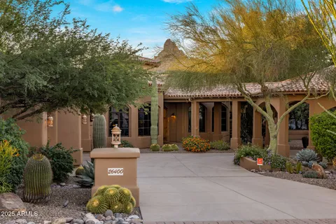 a view of a house with backyard porch and sitting area