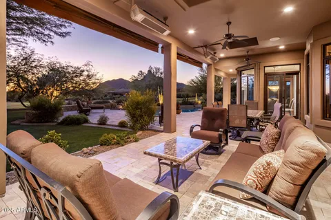 a view of a swimming pool with a yard