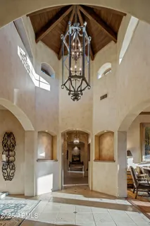 a view of a livingroom with furniture and chandelier