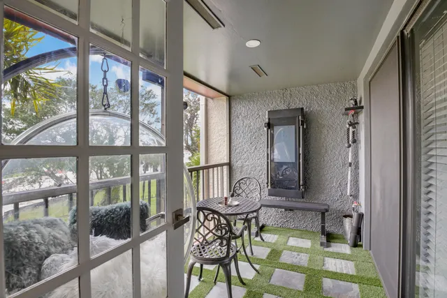 a balcony view with a garden