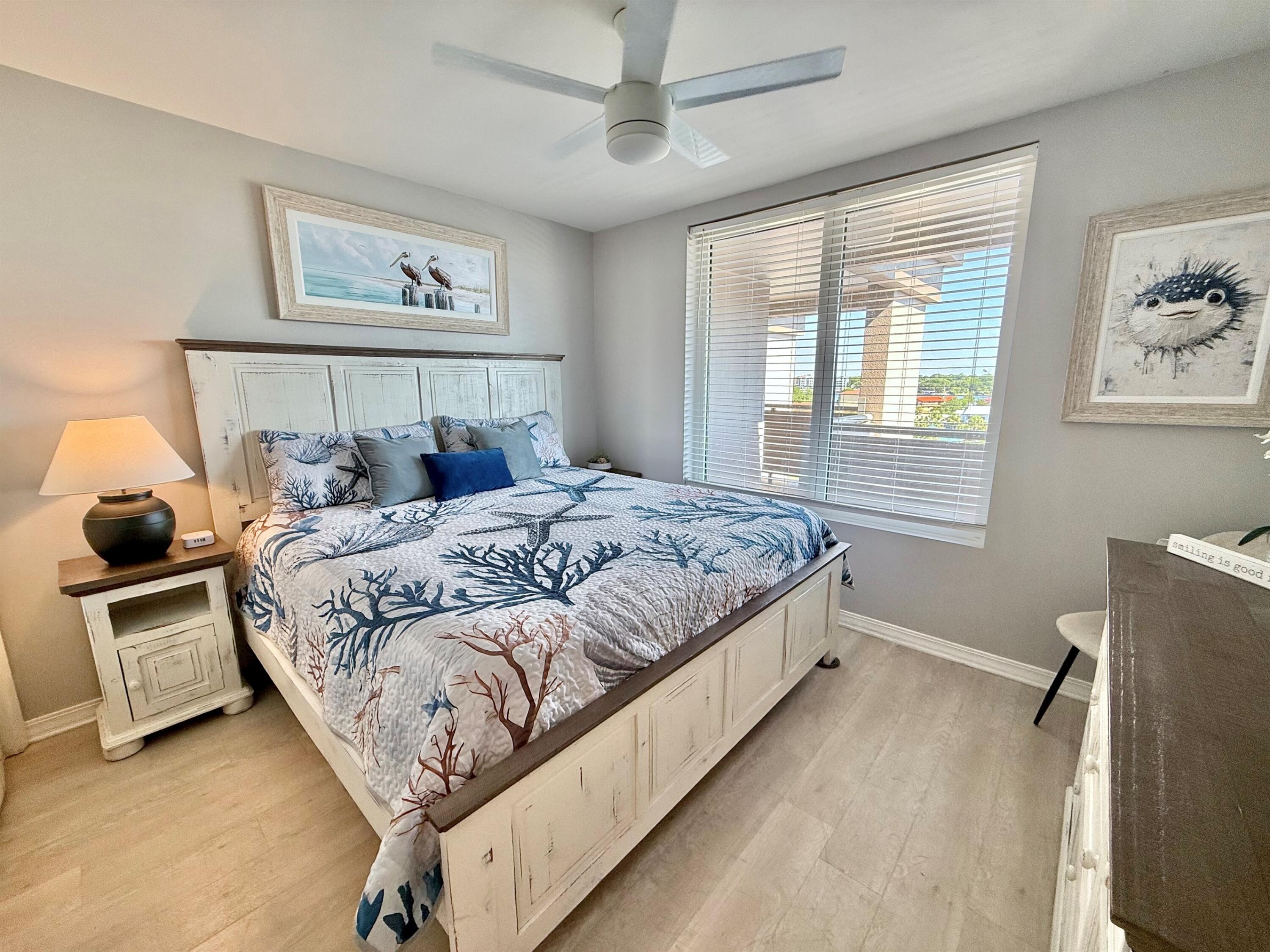 520 Santa Rosa Boulevard, Unit 705 Fort Walton Beach, FL 32548 - Photo 19 of 28 a bedroom with a bed and a window