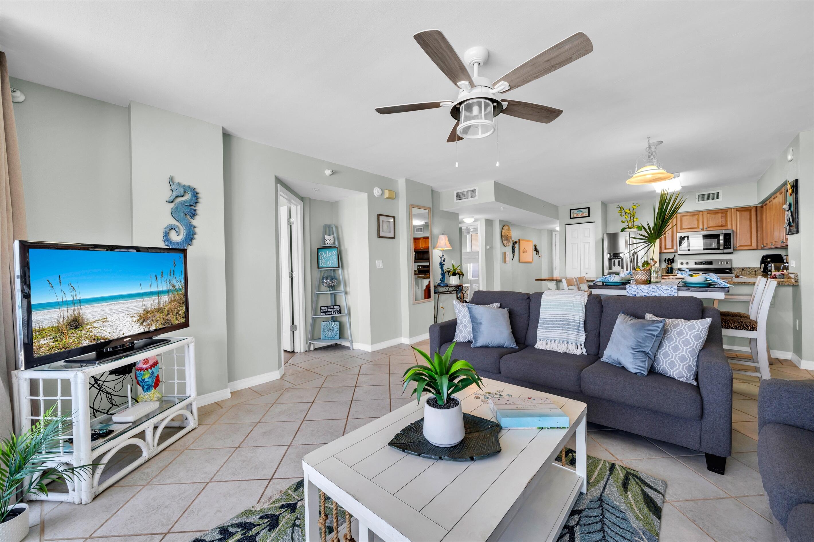 520 Santa Rosa Boulevard, Unit 705 Fort Walton Beach, FL 32548 - Photo 3 of 28 a living room with furniture and a flat screen tv