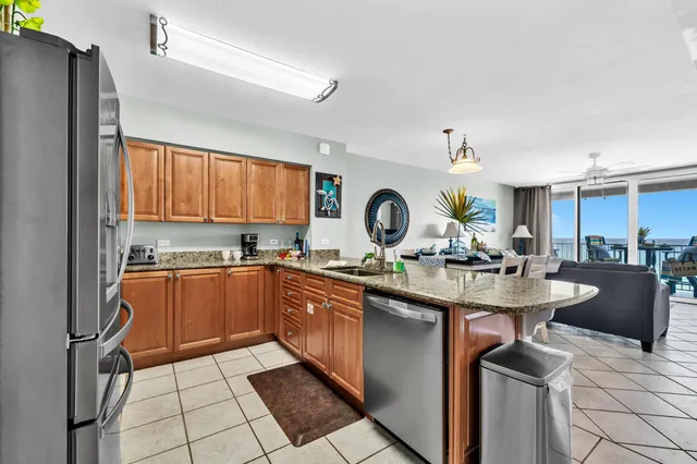 a kitchen with a sink appliances and cabinets