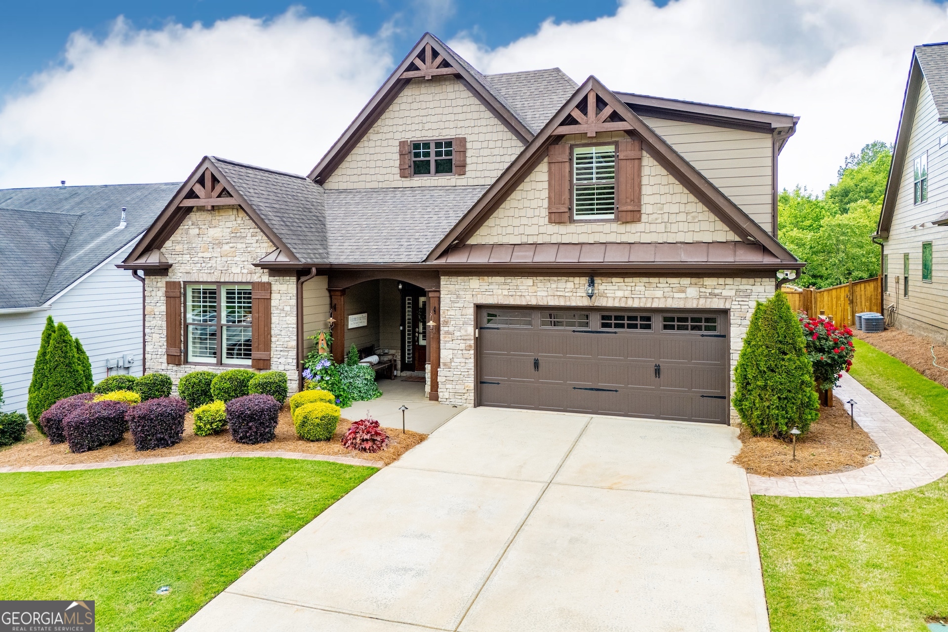a front view of house with yard and green space