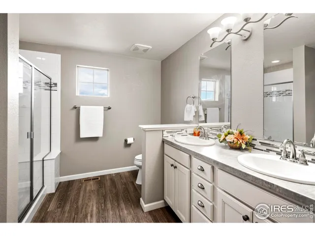 a bathroom with a sink a mirror and a light fixture
