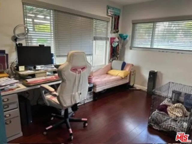 a bedroom with furniture and a window