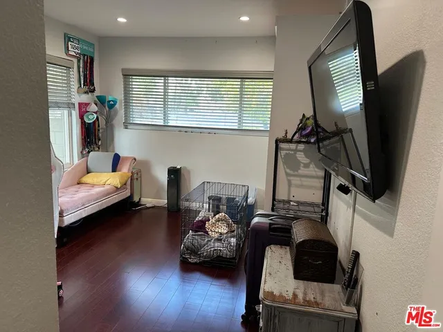 a bedroom with furniture and a window