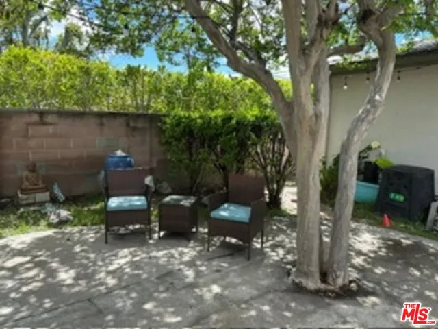 a view of a bench in a backyard