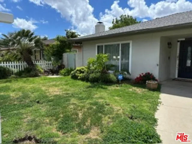 a view of a house with a garden